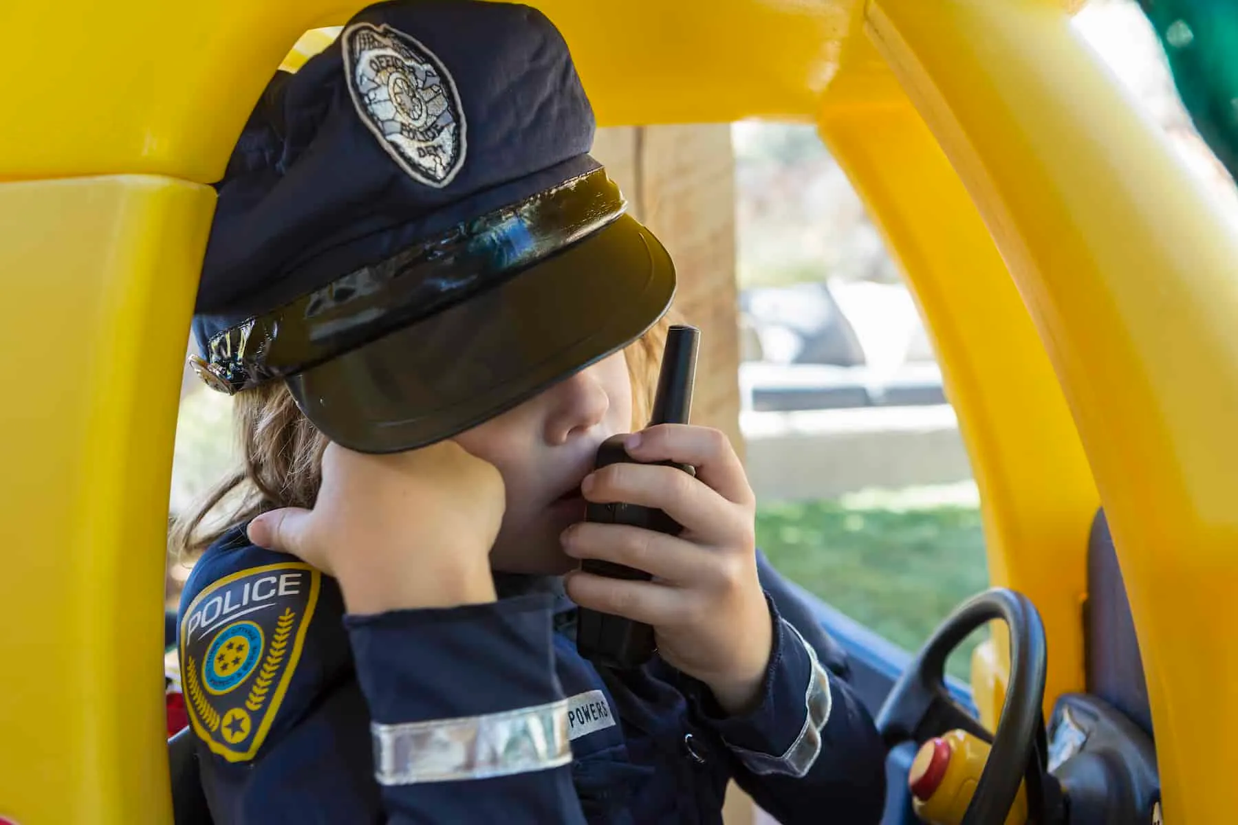 4 year old boy dressed as a police officer