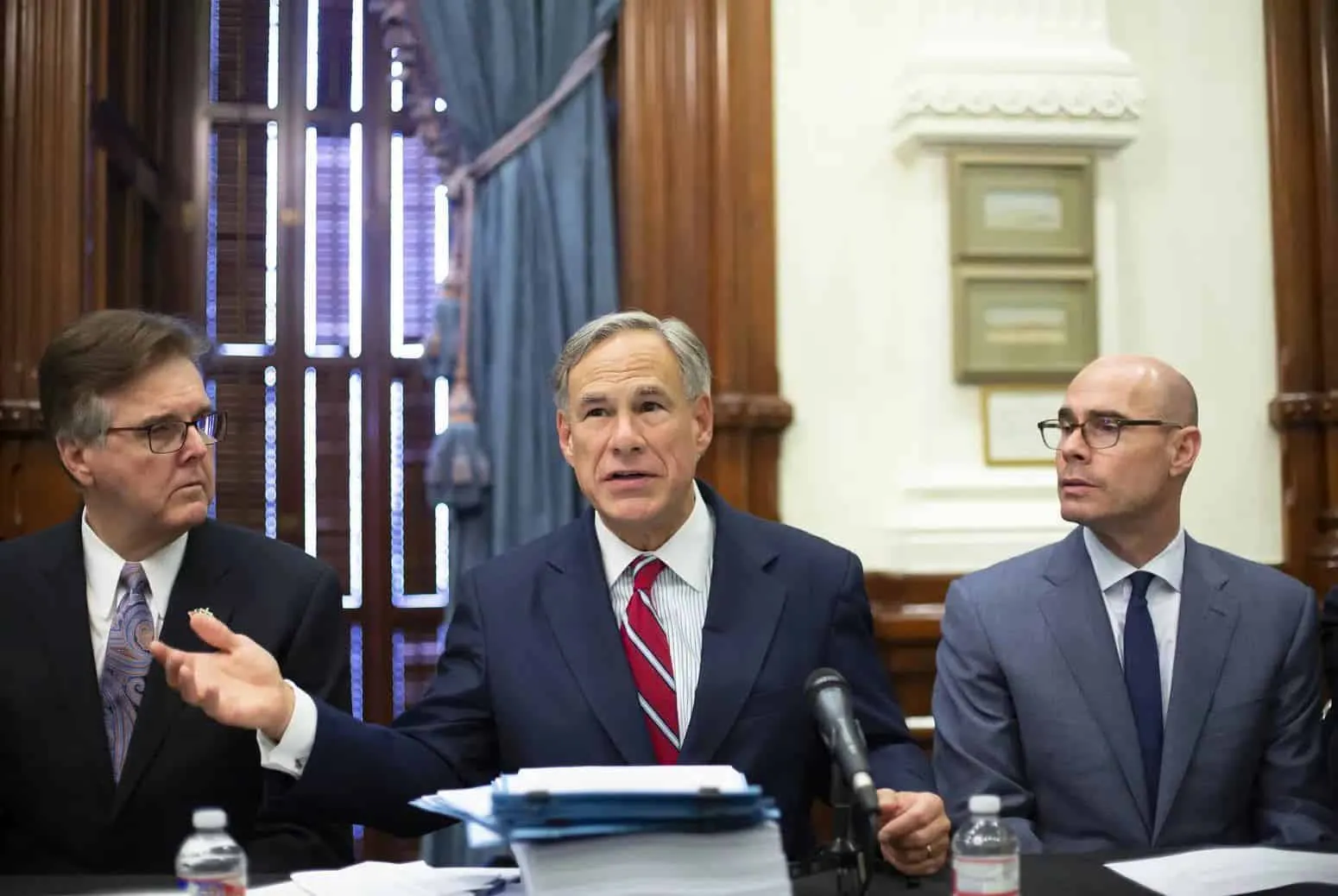 Gov. Greg Abbott along with Lt. Gov. Dan Patrick and House Speaker Dennis Bonnen, hold the first meeting of the Texas Safety Commission in 2019. On Tuesday, Abbott said lawmakers plan to craft legislation that will freeze property tax revenues in cities, like Austin, that cut police budgets. Credit: Marjorie Kamys Cotera for The Texas Tribune