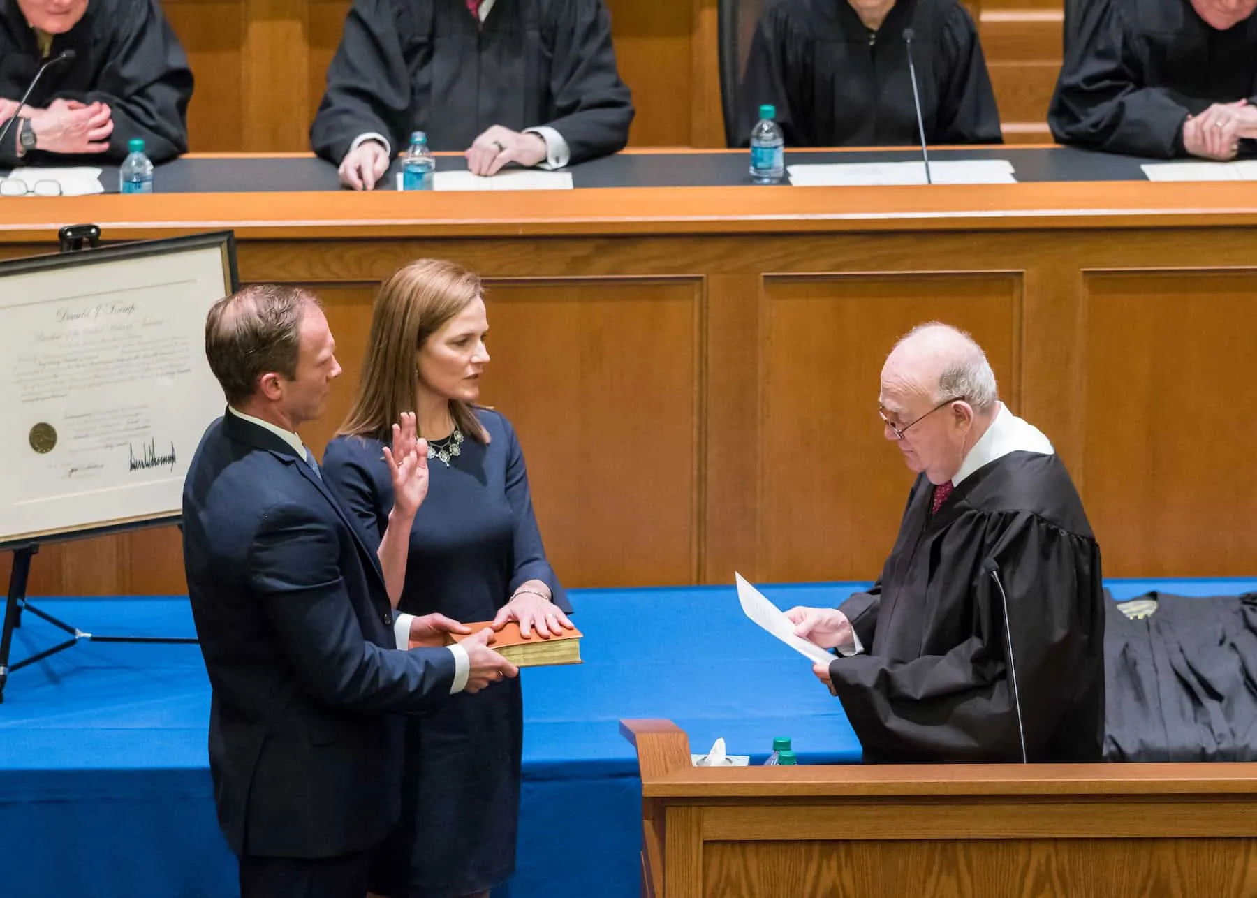 Judge Laurence Silberman, for whom Barrett first clerked after law school, swearing her in at her investiture as a judge on the Seventh Circuit. Photo Credit: VWEAA.