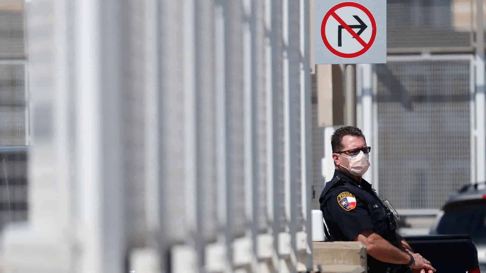 Credit: AP Amid concerns of the spread of COVID-19, a police officer wears a mask in Dallas, Wednesday, May 6, 2020. (AP Photo/LM Otero)