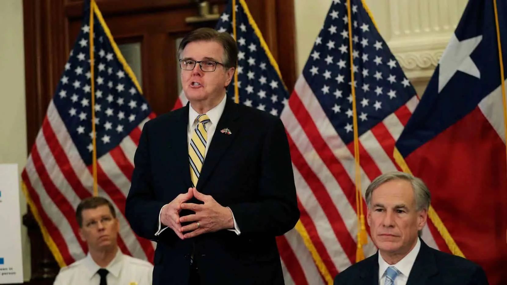 Lt. Gov. Dan Patrick, center, stands next to Texas Gov. Greg Abbott, right, during a news conference where the governor announced he would relax some restrictions imposed on businesses due to the COVID-19 pandemic, Monday, April 27, 2020, in Austin, Texas. (AP Photo/Eric Gay)(Eric Gay)