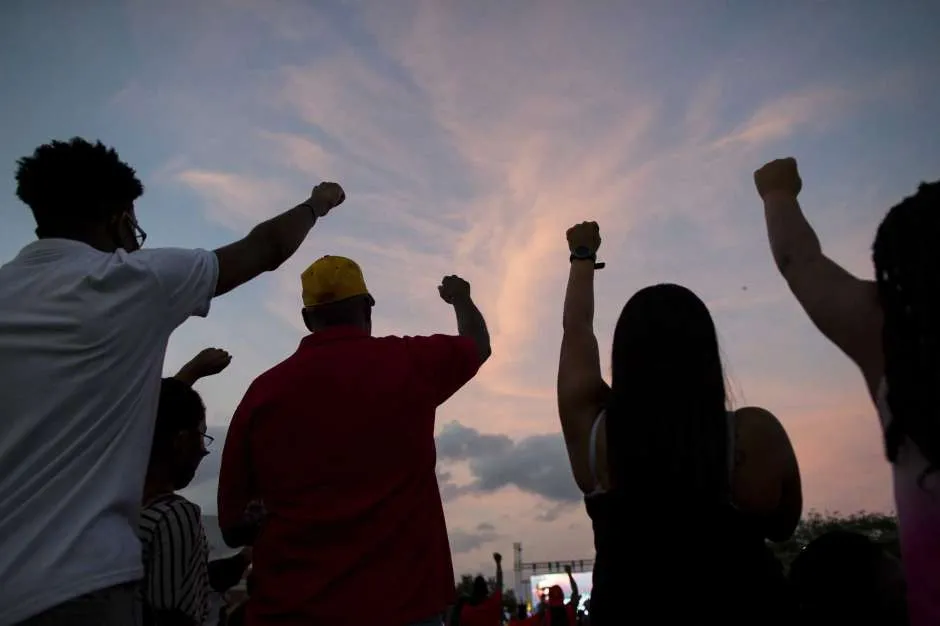 People participate in a candlelight vigil honoring George Floyd on Monday, June 8, 2020, at Jack Yates High School football field. Photo: Marie D. De Jesús, Houston Chronicle / Staff photographer