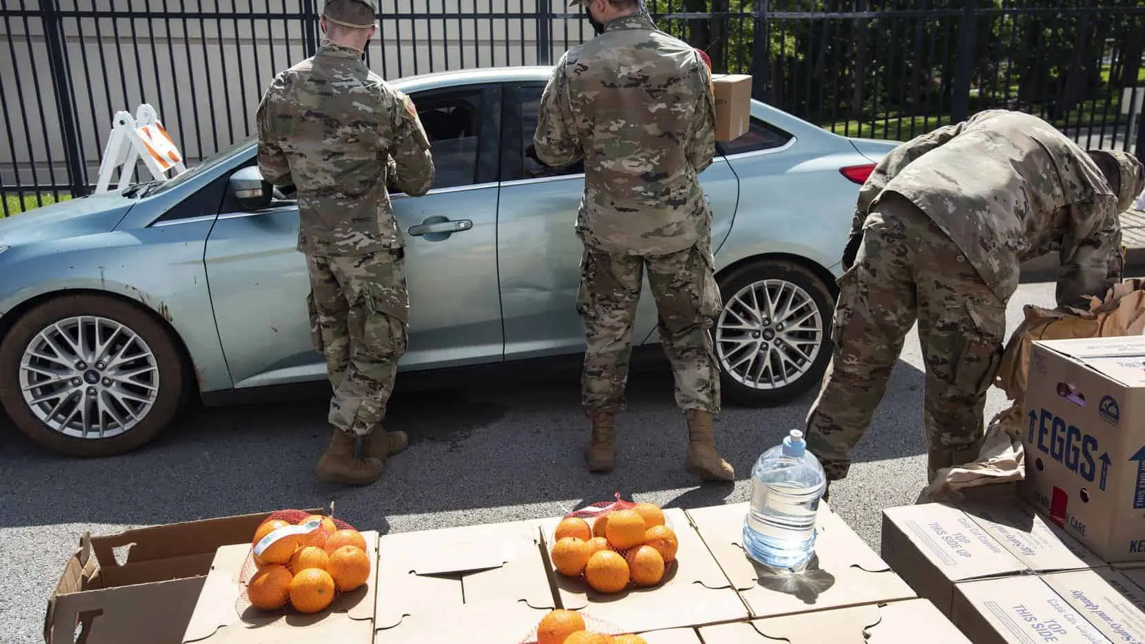 Members of the Texas Army National Guard worked the East Texas Food Bank drive-through emergency food distribution at the East Texas Fairgrounds in Tyler on April 24, 2020. In response to COVID-19, Texas Army National Guardsmen have been deployed to the East Texas Food Bank to ensure that the agency can continue to safely meet the need for food assistance in its 26-county coverage area. The deployment comes after the Smith County Emergency Operations Center submitted a STAR request for the guardsmen to support ETFB with its production, distribution and transportation tasks through May.(Sarah A. Miller)