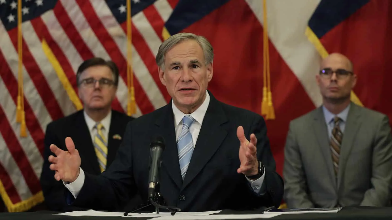 Texas Gov. Greg Abbott, center, with Lt. Gov. Dan Patrick, left, and Texas House Speaker Dennis Bonnen, right, speaks during a news conference where he announced he would relax some restrictions imposed on businesses due to the COVID-19 pandemic, Monday, April 27, 2020, in Austin, Texas. (AP Photo/Eric Gay)(Eric Gay)