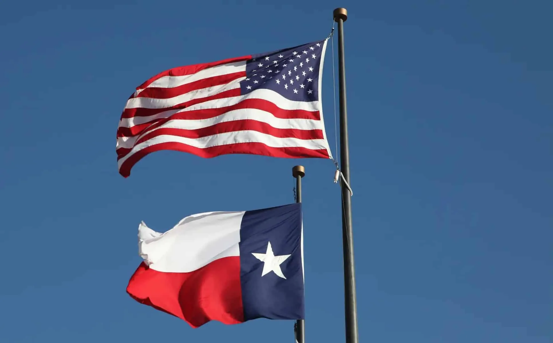American flag and Texas flag flying at the LBJ Library in Austin. Loop Images/Universal Images Group via Getty Images