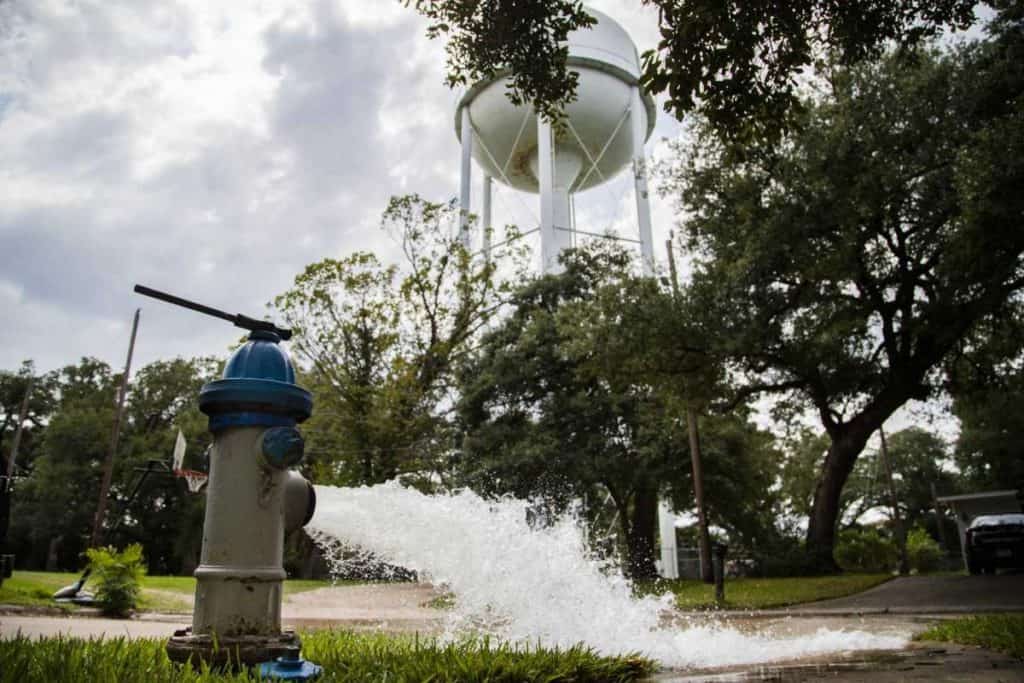 Water is flushed from a fire hydrant in Lake Jackson over the discovery that a brain-eating amoeba tainted the water supply.Photo: Marie D. De Jesús, Houston Chronicle / Staff photographer