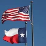 American flag and Texas flag flying at the LBJ Library in Austin. Loop Images/Universal Images Group via Getty Images